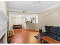Open-concept living area showcases hardwood floors and seamless transition to dining and kitchen spaces at 221 Ashford Cir, Atlanta, GA 30338