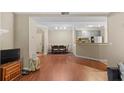 Spacious living room with hardwood floors leading to the dining area and kitchen at 221 Ashford Cir, Atlanta, GA 30338
