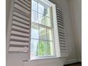 Window with white frame and white shutters at 1409 Oakridge Cir, Decatur, GA 30033