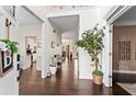Welcoming foyer featuring hardwood floors and an open view into other rooms at 607 Crimsonwood Ct, Powder Springs, GA 30127