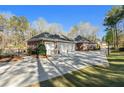 Spacious three-car garage with a long driveway and fenced pool area, perfect for Gathering living at 850 Cog Hl, Mcdonough, GA 30253