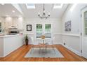 Bright dining area with skylights, wood floors, and French doors leading to the backyard at 2882 Concord Dr, Decatur, GA 30033