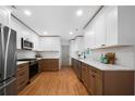 Modern kitchen features stainless steel appliances, two-tone cabinetry, and light countertops at 830 Lee Nw Dr, Marietta, GA 30060