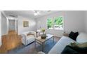 Bright living room with hardwood floors, recessed lighting, and neutral furniture at 830 Lee Nw Dr, Marietta, GA 30060