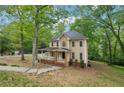 Two-story home with a welcoming front porch, landscaping, and classic design at 2650 Wendell Creek Ln, Snellville, GA 30039