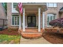 Inviting brick-lined porch with classic columns, perfect for enjoying a peaceful afternoon at 2930 Burnt Hickory Nw Rd, Marietta, GA 30064