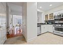 Modern kitchen featuring stainless steel appliances, white cabinets, and stylish tile flooring at 850 Piedmont Ne Ave # 1409, Atlanta, GA 30308