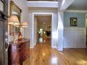 Inviting foyer with hardwood floors, high ceilings, and decorative console table creates a warm welcome into the home at 2859 Seagrave Way, Marietta, GA 30066