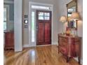 Charming foyer with hardwood floors and antique sideboard offers a glimpse into the well-appointed home at 2859 Seagrave Way, Marietta, GA 30066