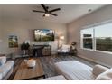 Bright living room featuring hardwood floors, a ceiling fan, a large window, and modern furniture at 360 Winston Cir, Canton, GA 30114