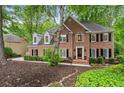 Attractive brick home with dormer windows, black shutters, and well-maintained landscaping at 4442 Freeman Rd, Marietta, GA 30062