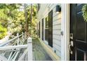 Inviting private balcony with black front door entry, and natural light, providing a tranquil outdoor space at 104 Terrace Ne Dr # 1, Atlanta, GA 30305