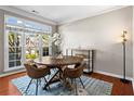 Cozy dining area with natural light and hardwood floors at 920 Pebblestone Ct, Alpharetta, GA 30009
