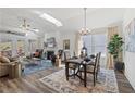 Open-concept living room with vaulted ceilings, a fireplace, and seamless access to the dining area at 1307 Cedarcrest Blvd, Acworth, GA 30101