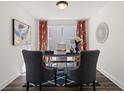 Bright home office with two chairs, modern decor, a blue rug, and natural light from a window at 1307 Cedarcrest Blvd, Acworth, GA 30101