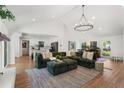 Spacious living room with vaulted ceiling and modern chandelier at 250 Hembree Rd, Roswell, GA 30075