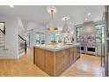 Open kitchen featuring a large island, stainless steel appliances, and modern pendant lights at 3265 Belmont Glen Se Dr, Marietta, GA 30067