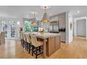 Kitchen with island, barstool seating, and bright windows overlooking the greenery at 3265 Belmont Glen Se Dr, Marietta, GA 30067