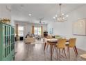 Open-concept living area with hardwood floors, modern chandelier, and comfortable seating at 1365 Memorial Se Dr # 8, Atlanta, GA 30317