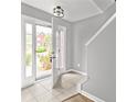 Inviting foyer featuring tiled flooring and abundant natural light, offering a warm welcome at 2727 Northgate Nw Way, Acworth, GA 30101