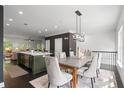Stylish dining room adjacent to open-concept kitchen and living area, perfect for Gathering gatherings at 404 Wade Creek Rd, Alpharetta, GA 30009