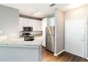 Well-lit kitchen featuring white cabinets, stainless appliances, and granite counters at 10 Ne Perimeter Summit Ne Blvd # 4428, Brookhaven, GA 30319