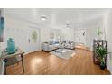 Inviting living room featuring hardwood floors, a ceiling fan, and stylish decor at 1961 Addison Ne Rd, Marietta, GA 30066