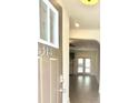 Inviting entryway with view into living area boasting hardwood floors and natural light at 6318 Scudders Dr, Lithonia, GA 30058