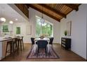 Stylish dining area featuring a large window, modern lighting, and an open layout at 4328 Alison Jane Ne Dr, Kennesaw, GA 30144