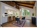 Stylish dining area featuring a large window, modern lighting, and an open layout at 4328 Alison Jane Ne Dr, Kennesaw, GA 30144