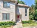 Charming two-story townhouse featuring a well-maintained lawn and a welcoming front entrance at 3500 Stonewall Pl, Atlanta, GA 30339