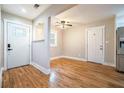 Bright entryway featuring gleaming hardwood floors, fresh paint, and easy access to the rest of the home at 446 Waterford Nw Rd, Atlanta, GA 30318