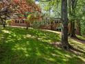 Classic brick home with a neatly landscaped front yard and mature trees at 579 Fielding Ln, Atlanta, GA 30311