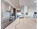Modern kitchen boasts sleek cabinetry, marble countertops, and stainless steel appliances at 3475 Oak Valley Ne Rd # 2940, Atlanta, GA 30326