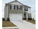Charming two-story home with a two-car garage and professionally landscaped yard at 330 Cotton Tail Ln, Villa Rica, GA 30180