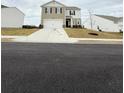 New construction two-story home with a two-car garage and professionally landscaped yard at 330 Cotton Tail Ln, Villa Rica, GA 30180
