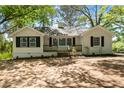 Charming, freshly renovated home with an unfinished lawn and dark shutters at 1825 Sw Willis Mill Rd, Atlanta, GA 30311