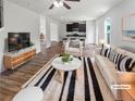 Bright living room with a contemporary design, stylish furnishings and an open concept layout at 4452 Belcamp Rd, Fairburn, GA 30213