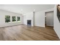 Spacious living area boasts fireplace, hardwood flooring, and large windows overlooking the yard at 361 Tallulah Ln, Grayson, GA 30017
