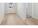 Bright entryway featuring wood-look floors and a view of the front door at 376 Tallulah Ln, Grayson, GA 30017