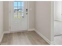 Bright foyer showcasing hardwood flooring and a view through the front door at 371 Tallulah Ln, Grayson, GA 30017