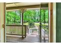 View from the front door, showcasing a covered porch and a glimpse of the wooded yard at 2253 Creekstone Ct, Marietta, GA 30062