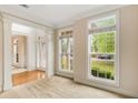 Sunlit living room with large windows offering serene outdoor views at 650 Virginia Highlands, Fayetteville, GA 30215
