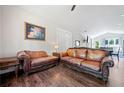 Spacious living room with hardwood floors, neutral walls, plenty of sunlight and comfortable leather sofas at 2909 Jones Mill Rd, Atlanta, GA 30360