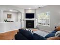 Inviting living room featuring a cozy fireplace, neutral tones, and abundant natural light at 4337 Orchard Park Ct, Stone Mountain, GA 30083