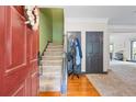 Welcoming foyer with hardwood floors and staircase at 168 Constitution Blvd # 12, Lawrenceville, GA 30046