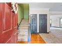 Inviting foyer with hardwood floors, staircase, and access to a spacious living area at 168 Constitution Blvd # 12, Lawrenceville, GA 30046