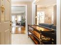 Inviting foyer with console table leading into a bright living room with hardwood floors at 211 Colonial Homes Nw Dr # 2508, Atlanta, GA 30309