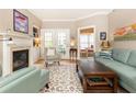 Cozy living room with fireplace, built-in bookshelves, and access to outdoor patio at 211 Colonial Homes Nw Dr # 2508, Atlanta, GA 30309