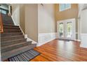 Spacious foyer with high ceilings and stairs at 4240 Hastings Dr, Cumming, GA 30041